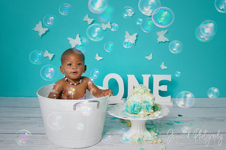 turquoise white and gold cake for a one year old baby girl. butterfly bacdrop