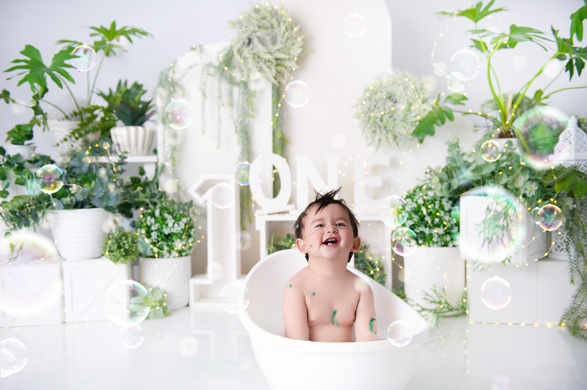 baby enjoying a luke warm milk bath