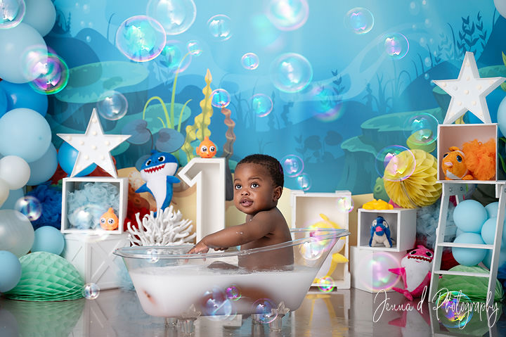 Baby in an underwater-inspired bubble bath with sea-themed balloons — supporting content about baby swim schools in Pretoria East.