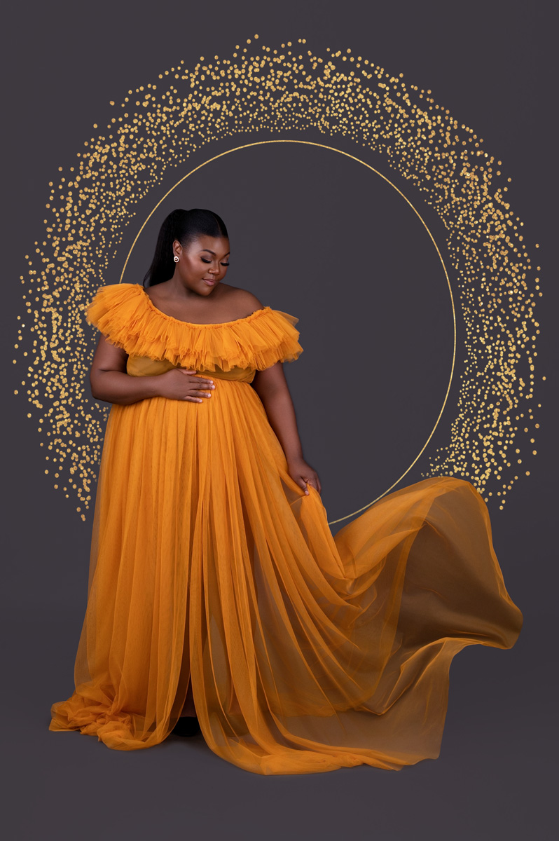Elegant maternity photoshoot in flowing mustard gown with gold halo backdrop – maternity photographer Pretoria