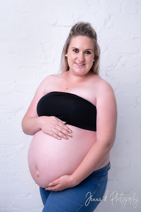 mommy with naked tummy in studio pregnancy photos