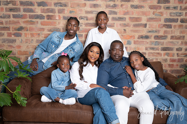 family on brown couch