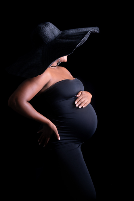 Pregnant lady with big black hat