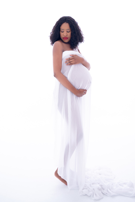 lady in studio white outfit maternity