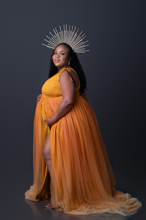 Lady in mustard dress - maternity