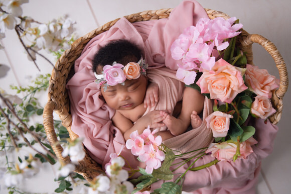 why newborn photoshoots with flowerss