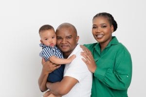 Family portrait with parents and baby Nkanyezi before the cake smash.