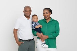 Family portrait with parents and baby Nkanyezi before the cake smash.