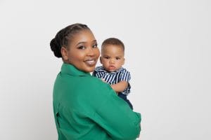 Family portrait with parents and baby Nkanyezi before the cake smash.