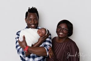 Three generations together — proud grandmothers holding baby Nomthandazo Zileni during family newborn session.