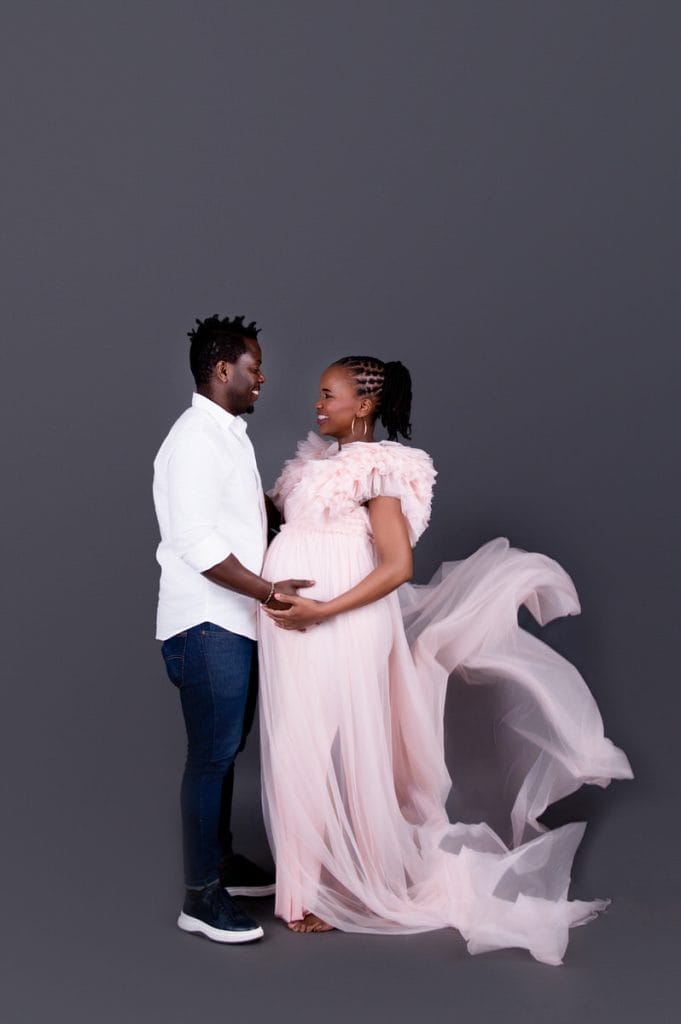 Creative pink fabric toss during maternity photoshoot Pretoria