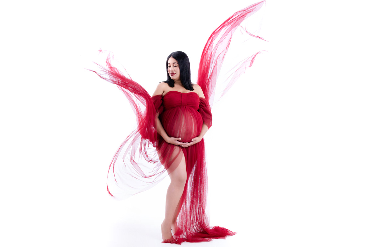 pregnant lady in Flowey elegant red dress