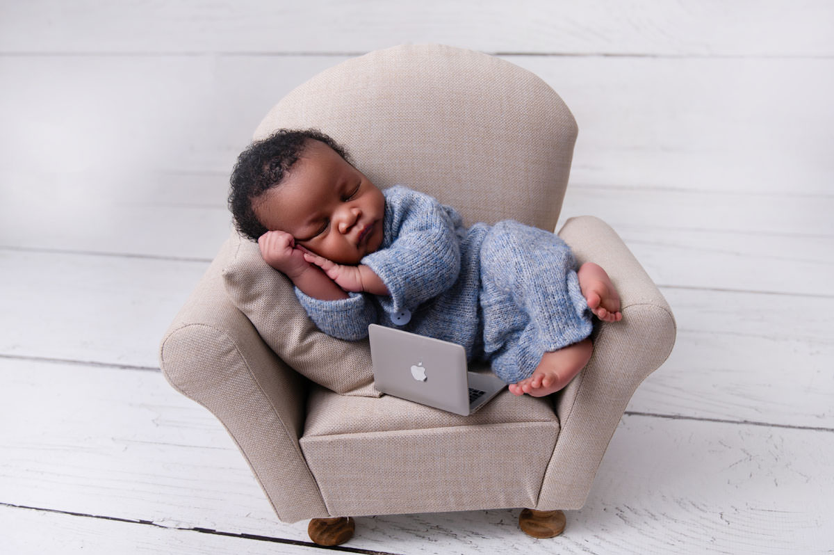 baby on tiny brown couch