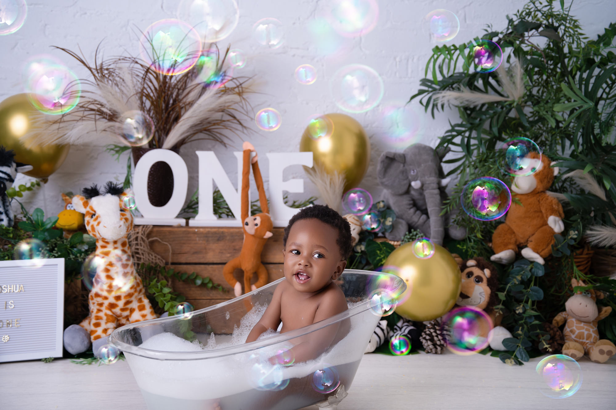 baby boy in milk bath splassing