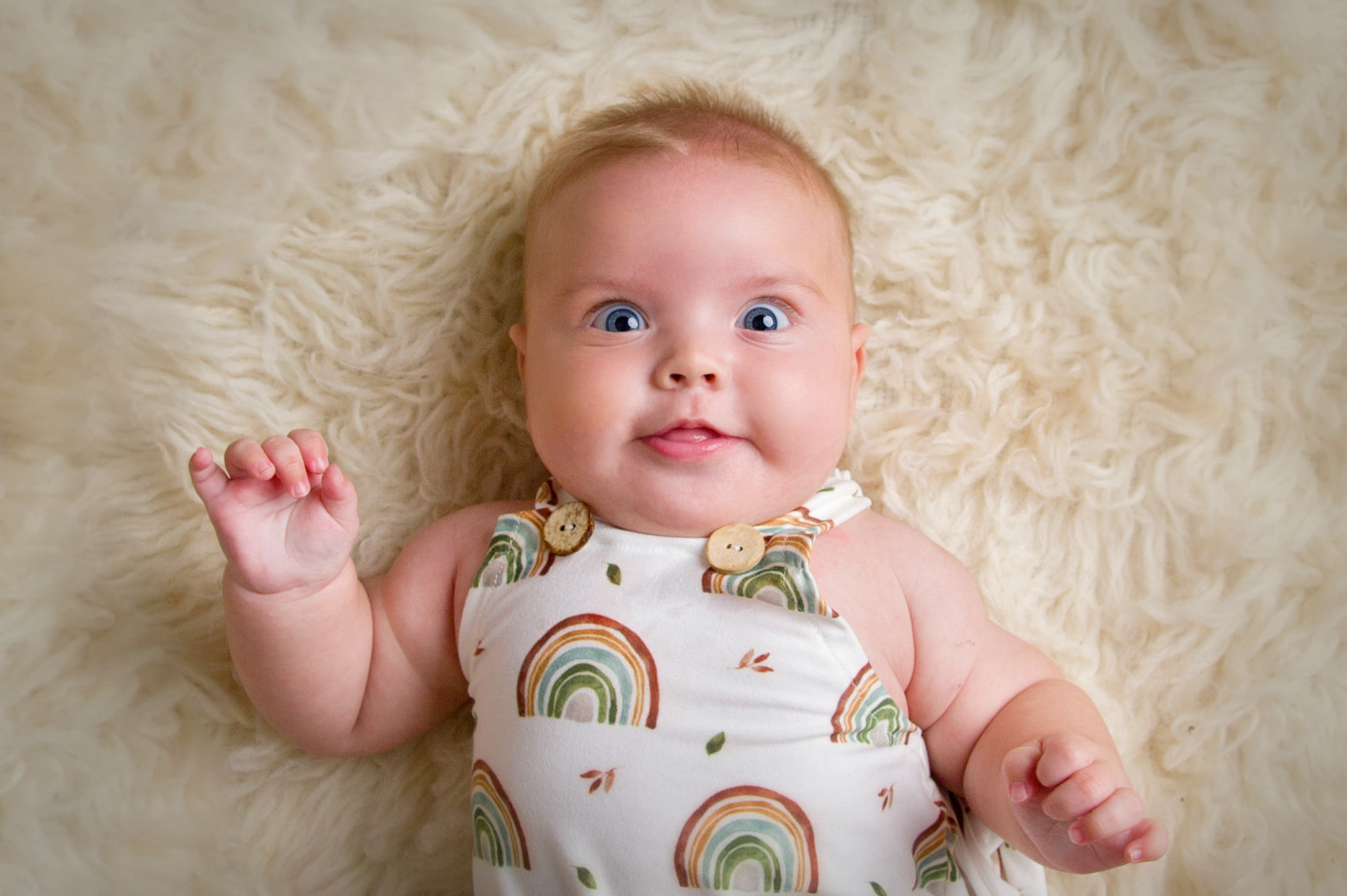 Happy baby smiling on mat at music classes for babies in pretoria
