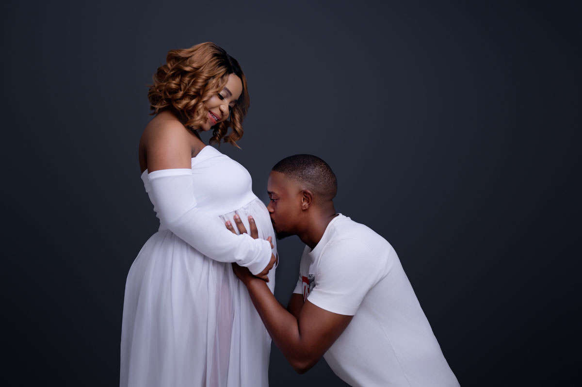 Intimate maternity photo of expecting couple, reflecting the supportive pregnancy journey often complemented by Pregnancy Massage Therapists in Pretoria East.